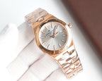 Rose gold-tone wristwatch, silver dial, metal bracelet