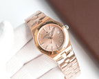 Rose gold-tone wristwatch, pink dial, metal bracelet