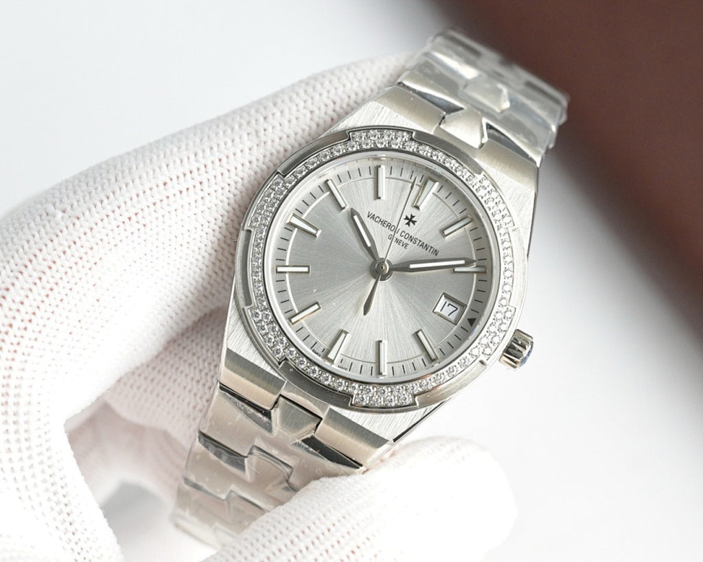 Vacheron Constantin wristwatch with white dial and diamond bezel on steel bracelet