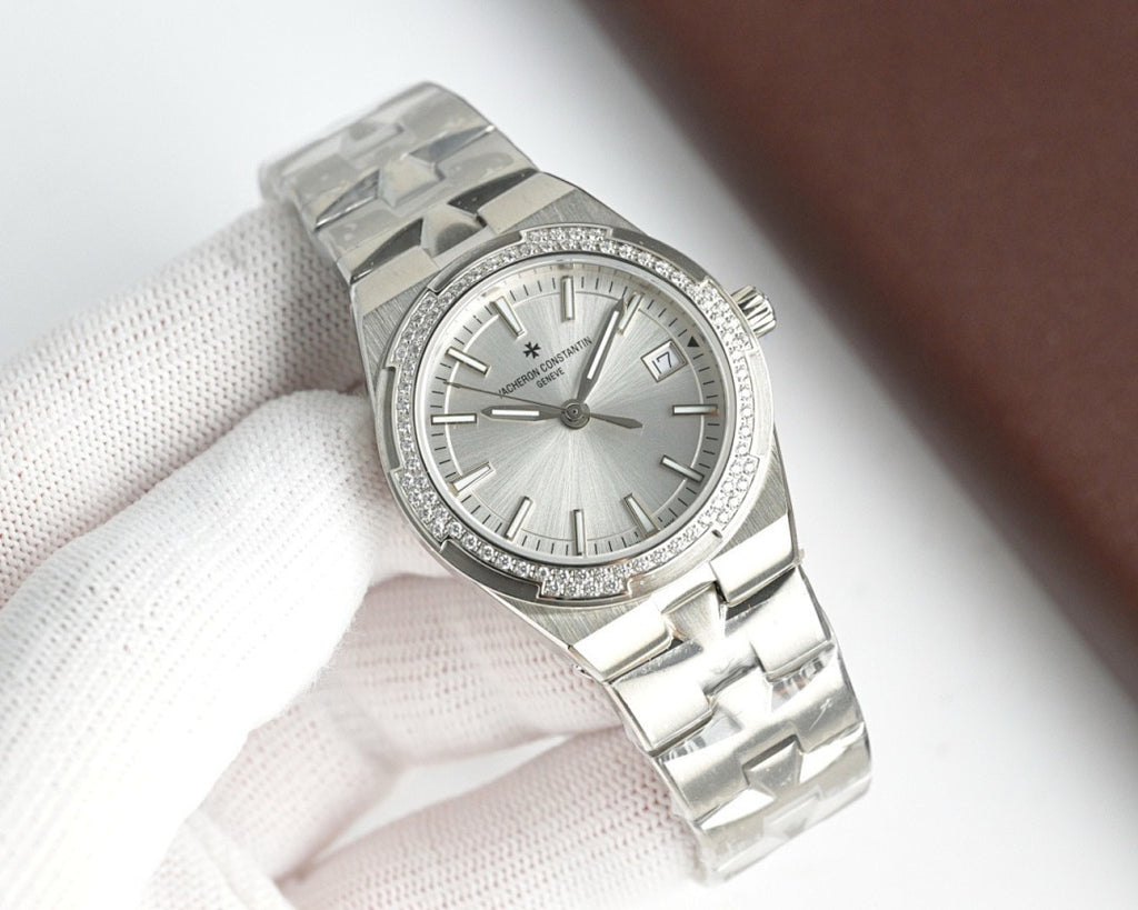 Vacheron Constantin wristwatch with white dial, diamond bezel, steel bracelet