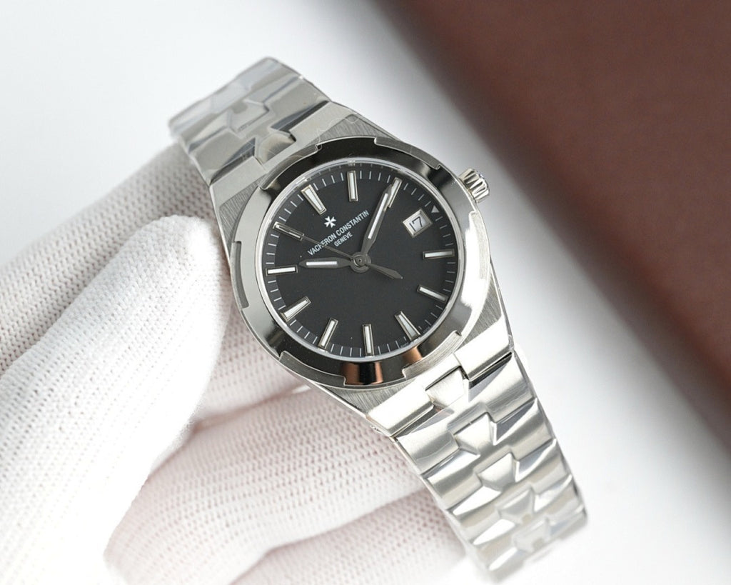 Vacheron Constantin stainless steel wristwatch with black dial and metal bracelet