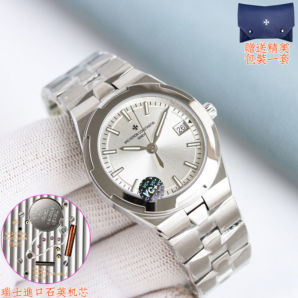 Stainless steel wristwatch with light dial and applied hour markers on a link bracelet.