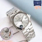 Stainless steel wristwatch with light dial and applied hour markers on a link bracelet.