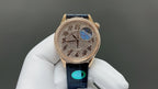 Vacheron Constantin watch front view with rose-gold tone dial, blue motif, and blue leather strap
