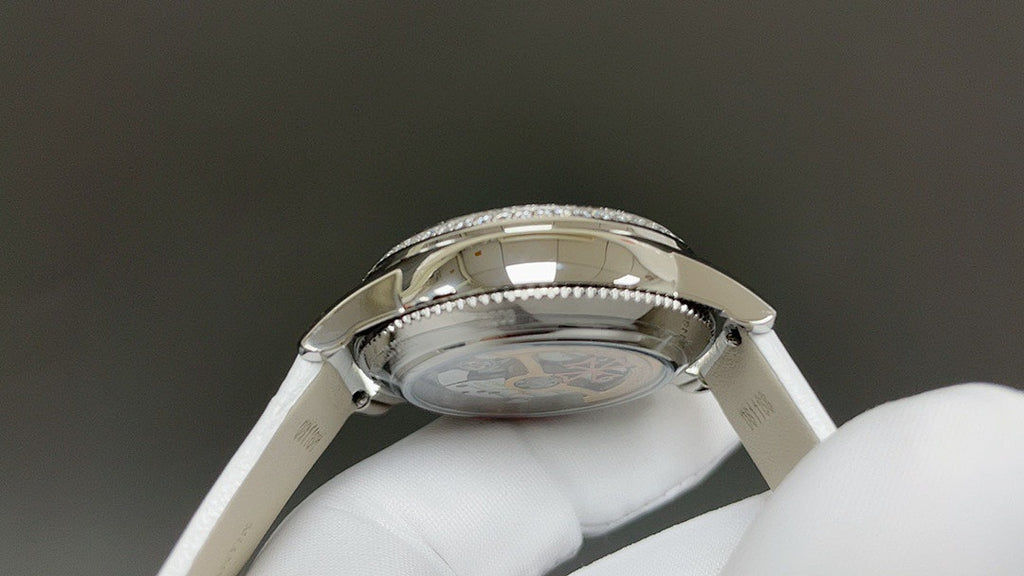Vacheron Constantin watch case back with polished bezel, white leather strap