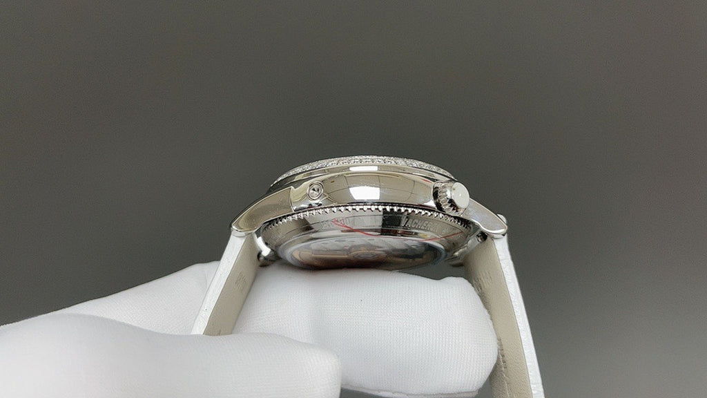 Vacheron Constantin watch case back close-up with crown detail, white leather strap