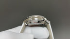 Vacheron Constantin watch case back close-up with crown detail, white leather strap