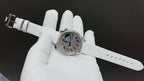 Vacheron Constantin watch on white leather strap with buckle and silver case, blue dial
