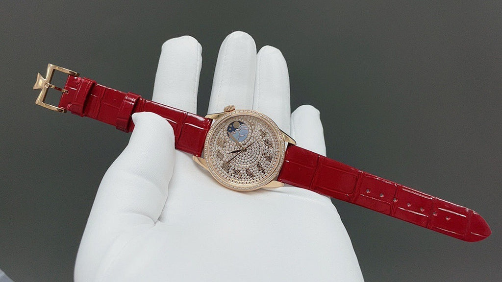 Vacheron Constantin watch with red leather strap and gold-tone crown