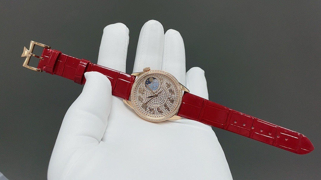 Vacheron Constantin watch with red leather strap and gold-tone crown