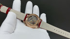 Vacheron Constantin watch with red leather strap and gold-tone case, clasp side view
