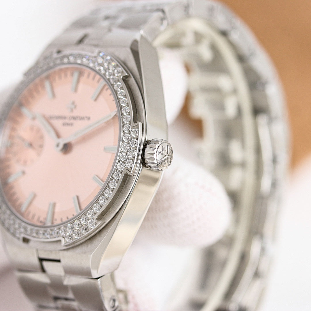 Vacheron Constantin watch with pale pink dial, crystal bezel, metal bracelet