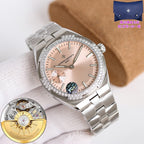 Vacheron Constantin watch with pale pink dial and crystal bezel, metal bracelet