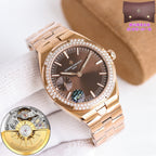 Gold-tone wristwatch, diamond bezel, dark dial, metal link bracelet