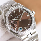 Stainless steel wristwatch with brown dial, jeweled bezel, and dual subdials