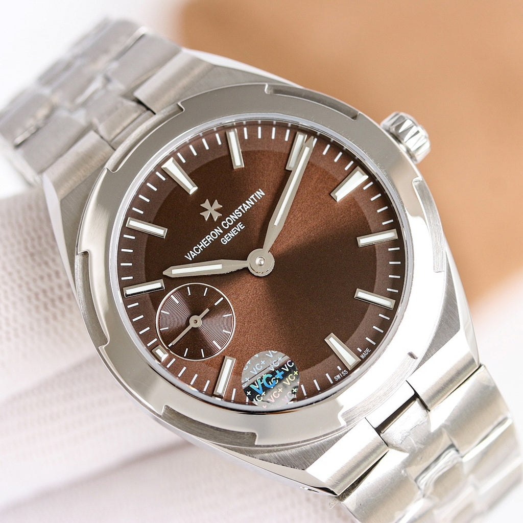 Stainless steel wristwatch close-up with brown dial and crown at right