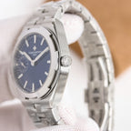 Men's steel wristwatch with dark blue dial, luminous markers, metal bracelet