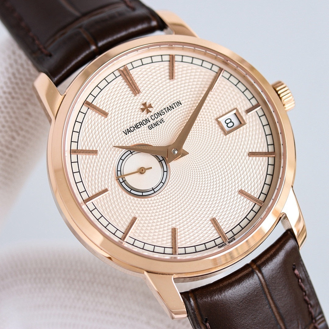 Vacheron Constantin wristwatch with rose gold case, textured white dial, and brown leather strap