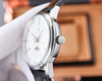 Vacheron Constantin watch with white dial and silver case, black leather strap and crown