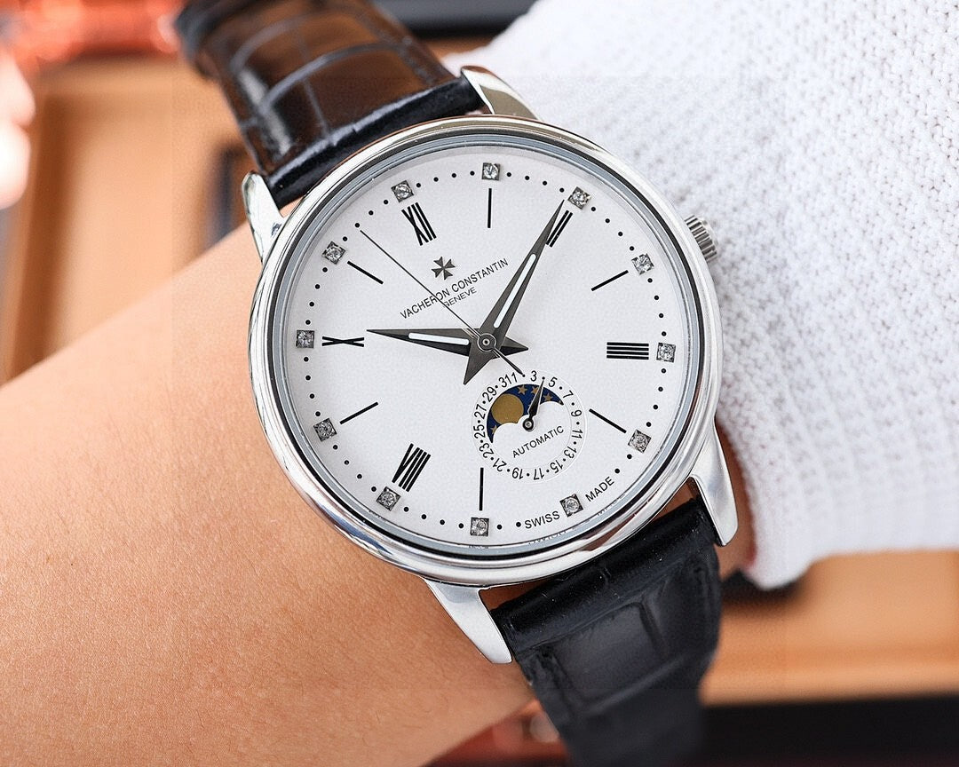 Vacheron Constantin watch on wrist with white dial, silver case, black leather strap