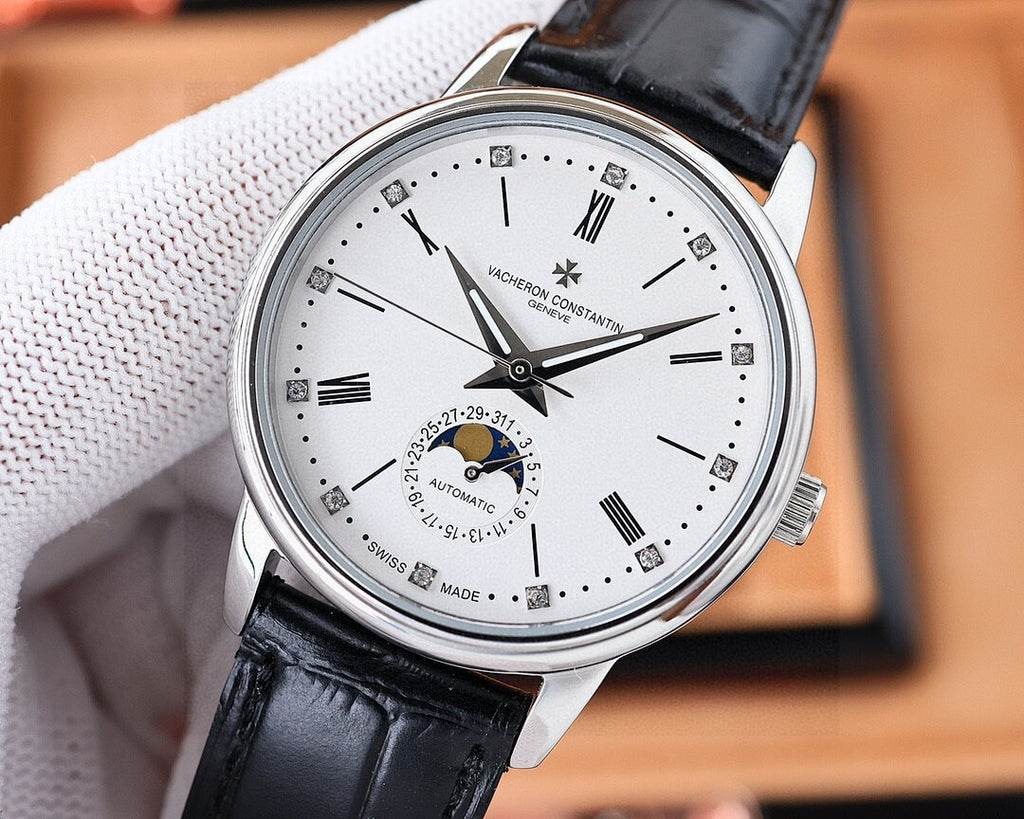 Vacheron Constantin watch with white dial, silver case, black leather strap in angled view