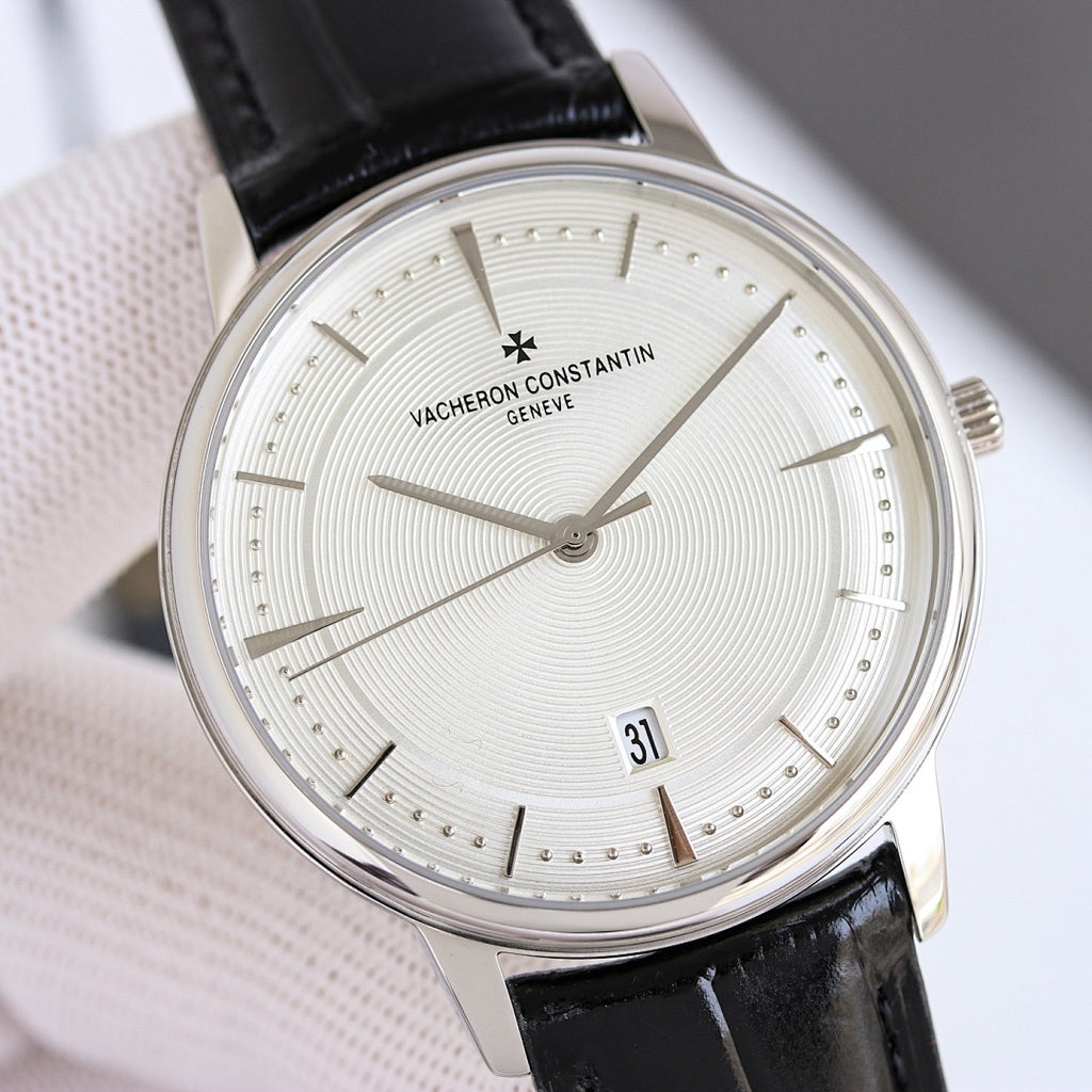 Vacheron Constantin wristwatch with silver case, white dial, date 31, black leather strap