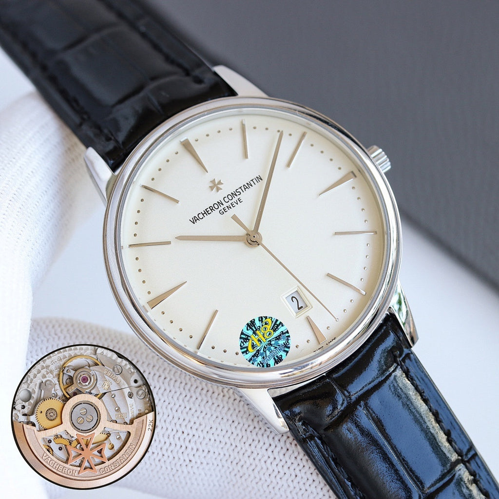 Wristwatch with white dial, black leather strap, steel case, and date window