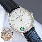 Wristwatch with white dial, black leather strap, steel case, and date window