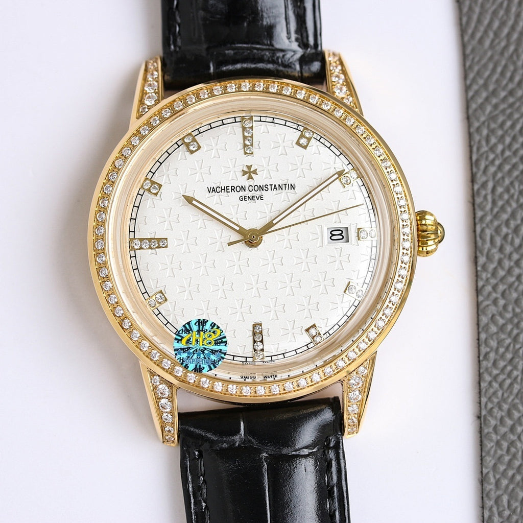 Gold-tone diamond bezel wristwatch with black leather strap, gold textured dial and date window
