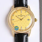 Gold-tone diamond bezel wristwatch with black leather strap, gold dial texture and date window