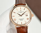 Analog wristwatch with brown leather strap, rose-gold case and white dial with baton indices.