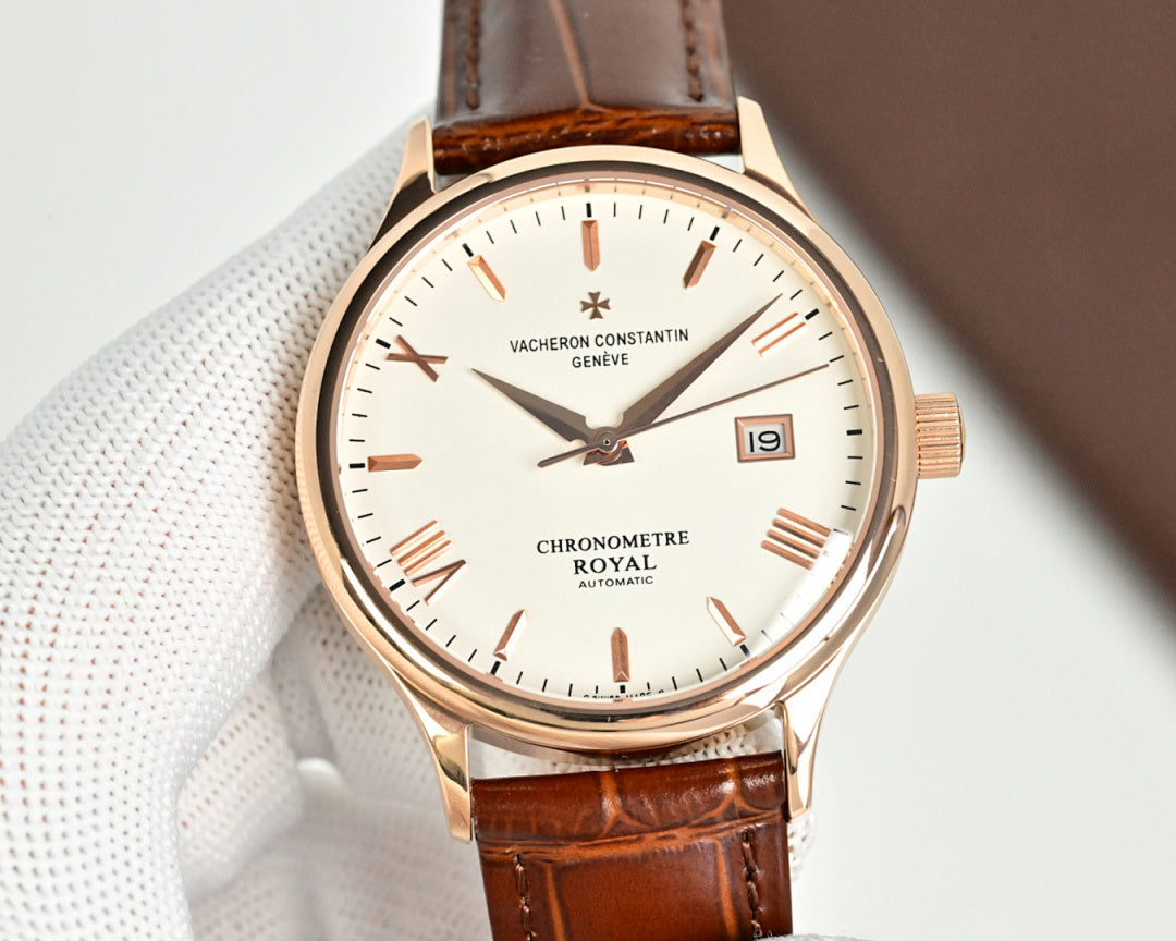 Analog wristwatch with brown leather strap, rose-gold case and white dial with baton indices.