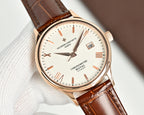 Analog wristwatch with brown leather strap, white dial, gold-tone crown, and date window.