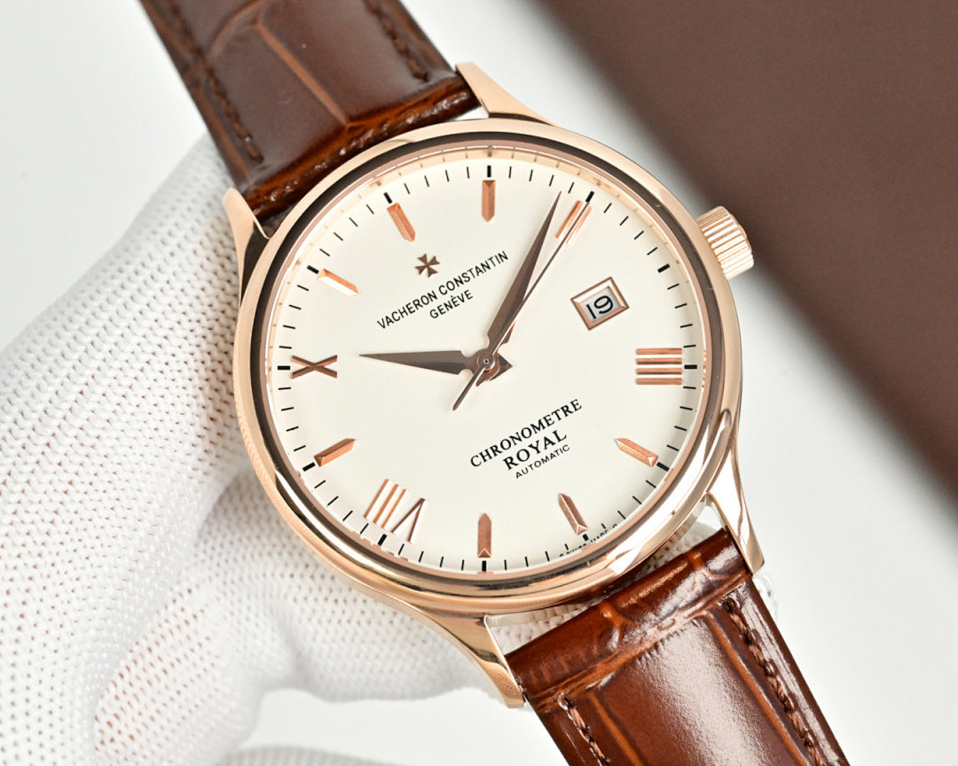 Analog wristwatch with brown leather strap, white dial, gold-tone crown, and date window.