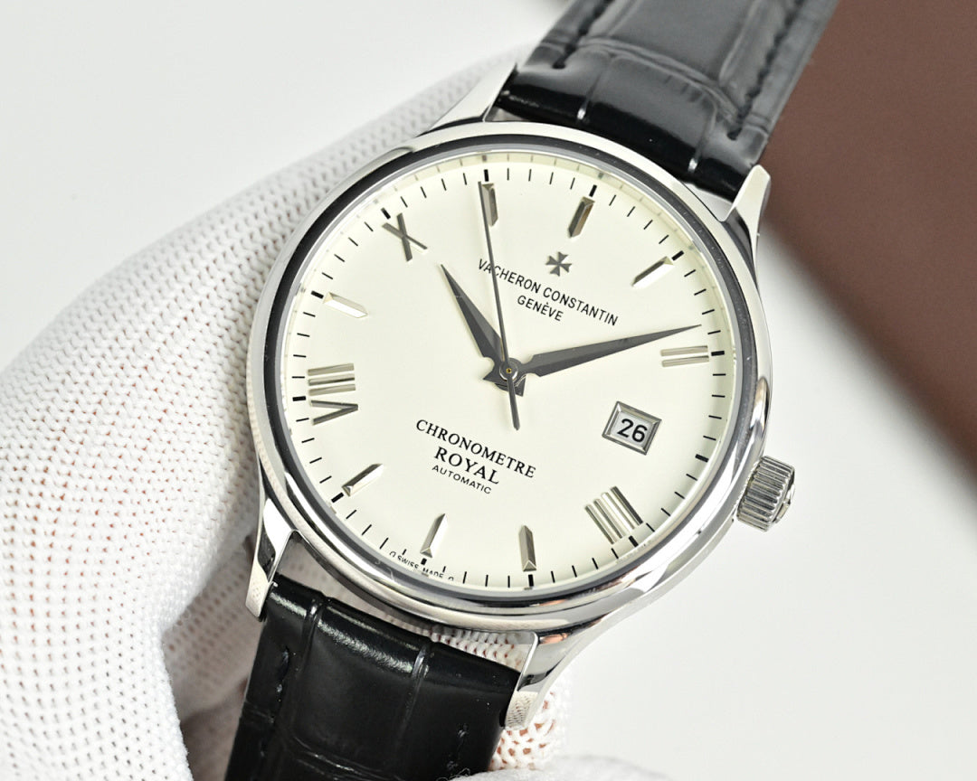 Analog wristwatch with black leather strap and white dial, baton markers and date at 26.