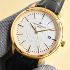 Gold wristwatch with white dial, black leather strap, and date window at 22