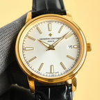 Vacheron Constantin gold wristwatch with white dial and black leather strap, date 7