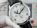 Vacheron Constantin wristwatch front close-up with black leather strap, silver case, Roman numerals