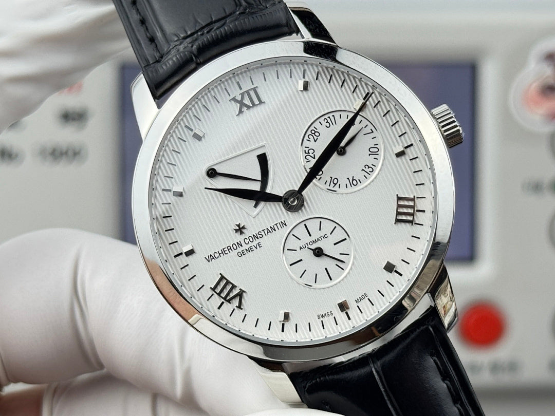 Vacheron Constantin wristwatch front close-up with black leather strap, silver case, Roman numerals