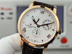 Vacheron Constantin watch with textured silver dial, Roman numerals, black leather strap