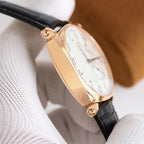 Vacheron Constantin wristwatch profile view, gold-tone case with black leather strap