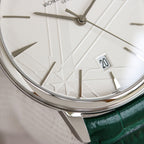 White dial wristwatch with silver bezel, baton hour markers, and date window