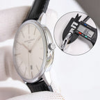 Vacheron Constantin watch with black leather strap, silver case, white dial