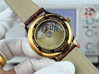Gold-cased wristwatch caseback with engraved text and mechanical details