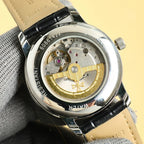 Vacheron Constantin automatic wristwatch with see-through back, gold-toned mechanism, leather strap