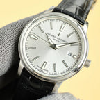 Vacheron Constantin wristwatch close-up with light silver dial, black leather strap, date 29
