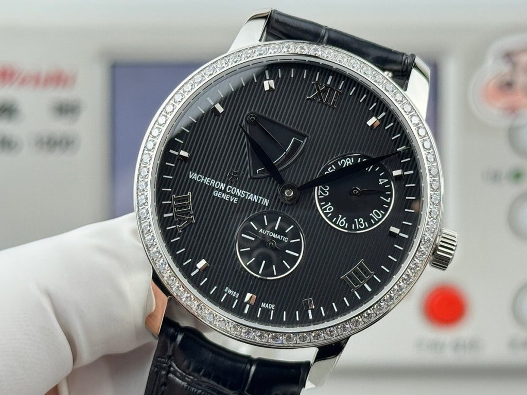 Vacheron Constantin wristwatch with black dial, roman numerals, and black leather strap