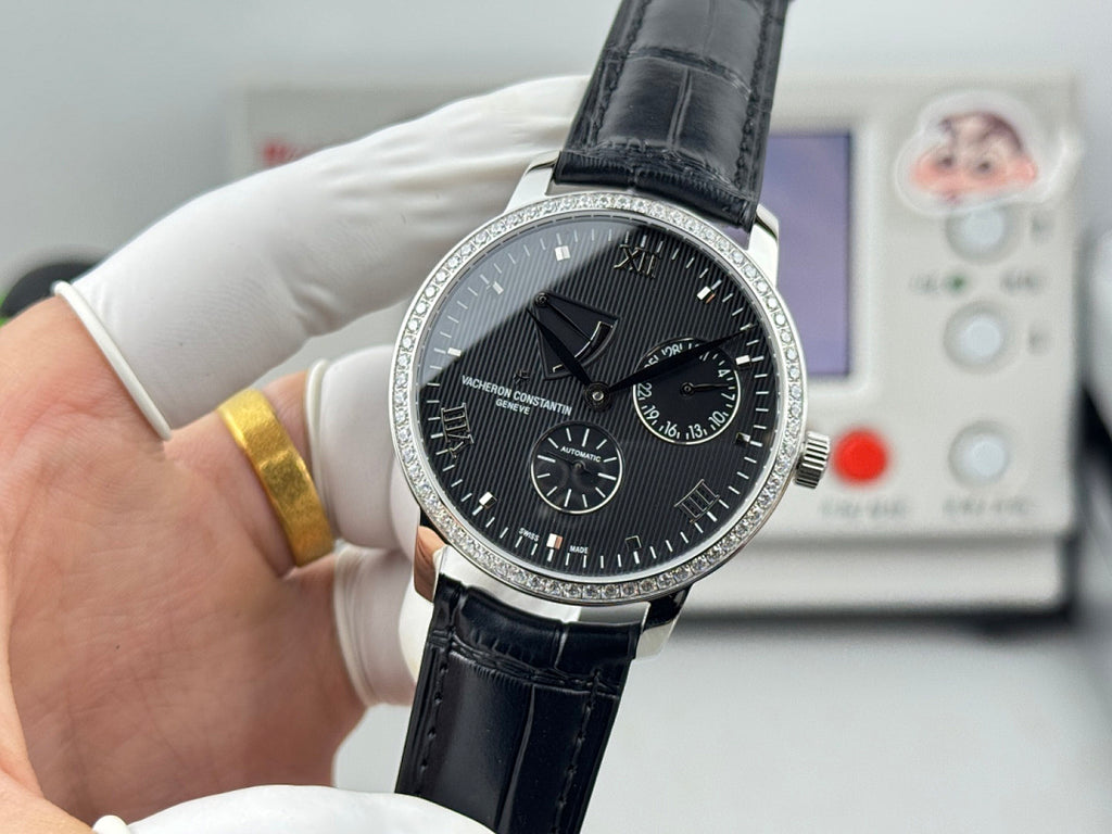 Vacheron Constantin wristwatch with black dial and black leather strap, three-quarter view