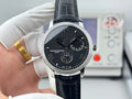 Vacheron Constantin wristwatch with black dial, silver bezel, and black leather strap