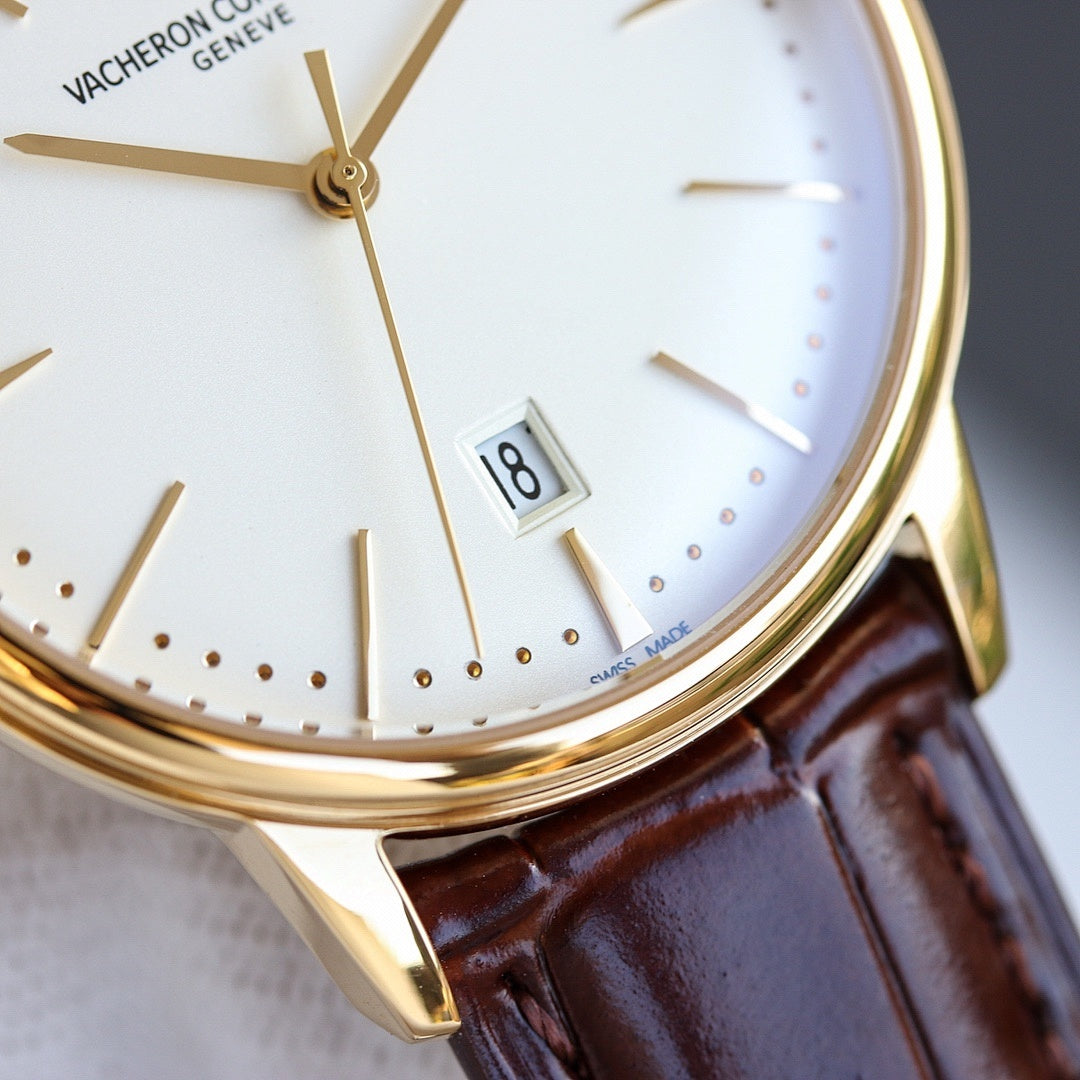 Vacheron Constantin watch close-up of white dial, gold hands, date window, brown strap